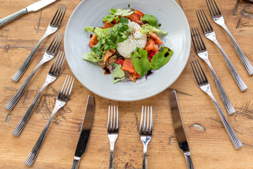  salad surrounded by forks