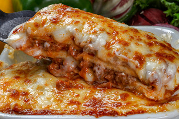 Traditional lasagna made with minced beef bolognese sauce