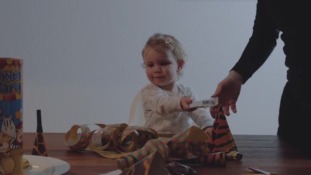 Baby and Parents Celebrating at Table