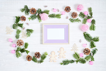 Festive composition of Christmas decorations on white wooden background.