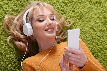 Portrait of beautiful woman listening to music