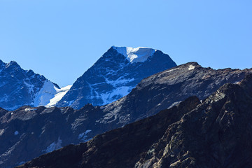 The top of the mountain Nakra Tau with snow and glaciers in the North Caucasus.
