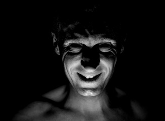 Stylish portrait of adult caucasian man. He smiles like maniac and seems like maniac or crazy....