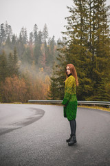 Fototapeta premium Concept of women's loneliness. Alone girl at forest, sad mood, depression, feelings 