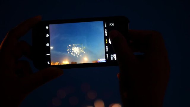 Take off on the phone a beautiful fireworks in the night sky. slow motion, 1920x1080, full hd