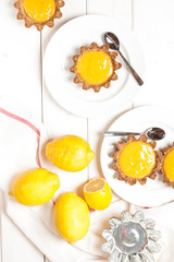 Lemon tart on white plate. Top view