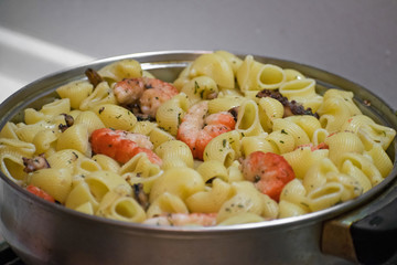 Seafood pasta with clams, prawns. Seafood Cocktail close up.