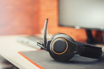 headphones gear and monitor keyboard blurred selected focus