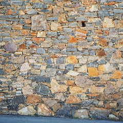 Part of grunge colorful stone blocks wall