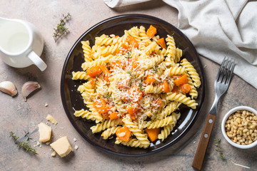 Pumpkin pasta with thyme, cream sauce and parmesan.