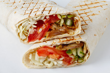 Shawarma cut on a white background. Middle Eastern dish prepared on the grill.