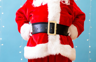 Santa claus on a shiny light blue background