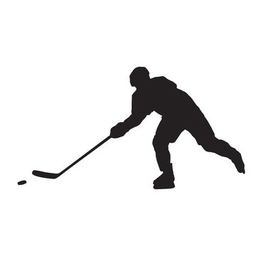 Ice hockey player passing puck, isolated vector silhouette, side view