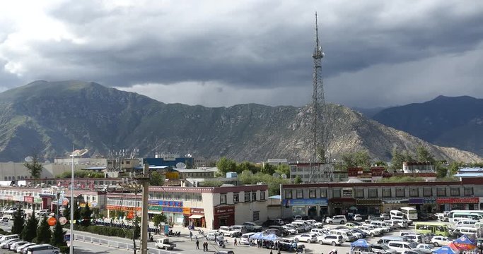 4k tourist visit potala in Lhasa,Tibet.busy traffic & white stupa.