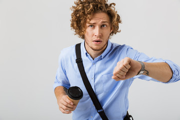 Worried young businessman running late