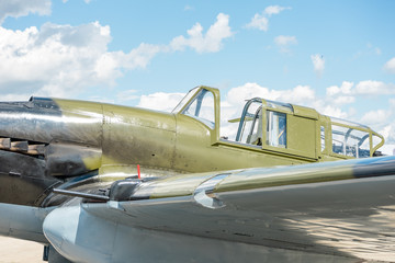 Fototapeta na wymiar Military retro plane with an open cockpit