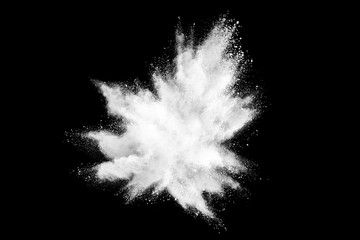 White powder explosion on dark background.