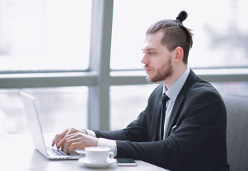 modern businessman typing on laptop.photo with copy space.