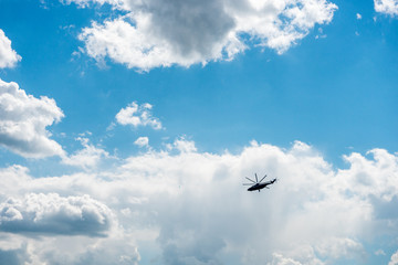 Military Helicopter flying high in the sky