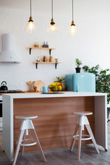 Stylish kitchen interior with dining table and chairs