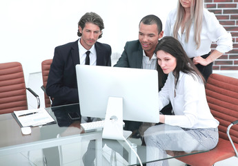 business people discussing financial information,sitting at his Desk