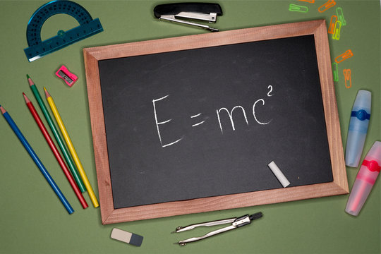 Back To School Concept. Einsteinian Theory Of Relativity Written On Chalkboard
