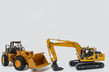Excavator and Wheel loader model isolated on white background in industrial construction