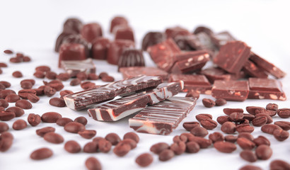 close up.set of chocolate bars and coffee beans. isolated on whi