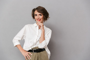 Portrait of a pensive young woman dressed in white shirt