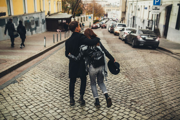 young couple walks on the city