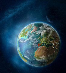 Portugal from space on Earth surrounded by space with Moon and Milky Way. Detailed planet surface with city lights and clouds.