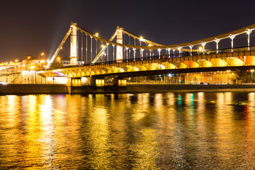 Fototapeta premium The long beautiful bridge across the river in the evening.