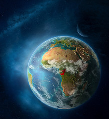 Congo from space on Earth surrounded by space with Moon and Milky Way. Detailed planet surface with city lights and clouds.