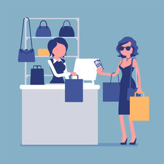 Woman paying with cash at handbags department