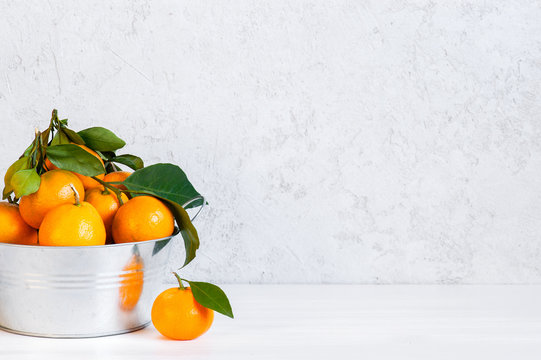 White background with fresh ripe tangerines © alinakho