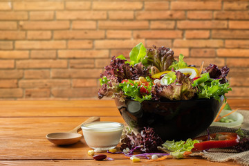 Fresh vegetables salad for healthy eating food and modern lifestyle on wooden floor.