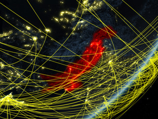 Pakistan on model of planet Earth with network at night. Concept of new technology, communication and travel.