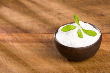 Natural sweetener in powder from stevia plant - Stevia rebaudiana. Top view