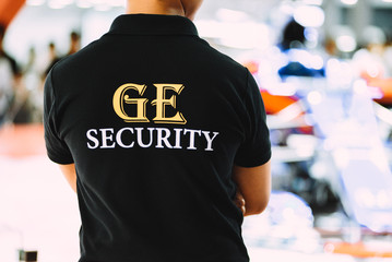 HO CHI MINH CITY, VIETNAM - OCTOBER 2018: Male security guard is working in the event. Back of...