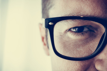 Close up of man with eyeglasses.