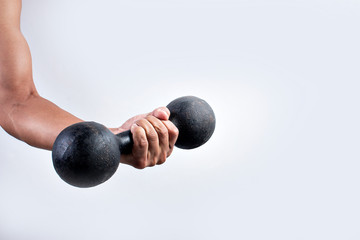 Hand holding dumbbells on white background