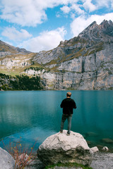 Fototapeta na wymiar Hiker enjoing beautiful view of Lago di Braies or Pragser wildsee, Italy.