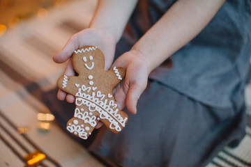 girl holding christmas cookies