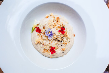 Hazelnut soup, dessert in big white plate