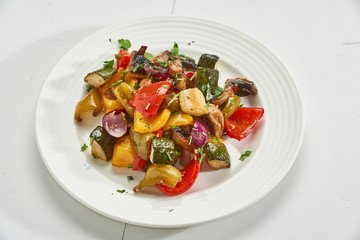 Sliced vegetables baked in the oven nice serving on a plate