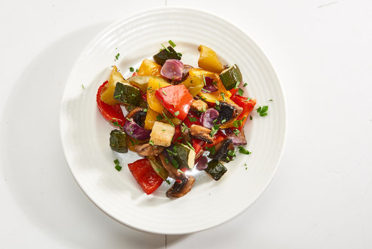 Sliced vegetables baked in the oven nice serving on a plate