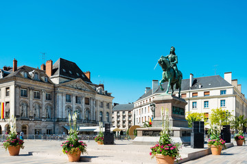 Fototapeta premium ORLEANS, FRANCE - May 8, 2018: statue Joan of Arc is an 1874 French gilded bronze equestrian sculpture of Orleans Cathedral in Orleans, France