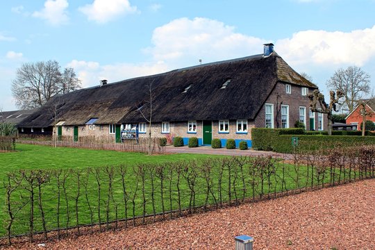 Staphorst, Netherlands, April 2016. Typical farm house painted in traditional colors of the Dutch village.