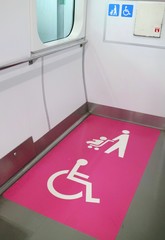 The sign of area for disabled and baby stroller in railways. Universal design in Japan. Sign and transportation concept.