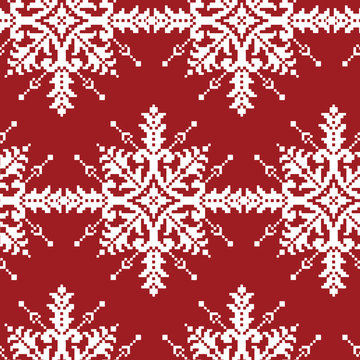 White Cross-Stitch Snowflakes Seamless Pattern on Red. Traditional Christmas Wallpaper